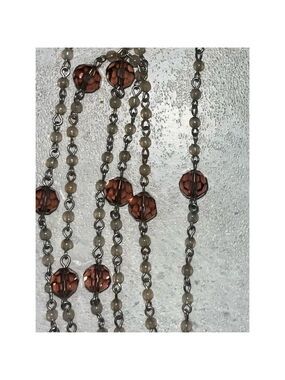 Necklace purple brown light shows tiger eye design
